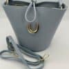 bolso-de-mujer-de-piel-azul-nudo-asa-lopezientos.jpeg