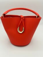 bolso-de-mujer-de-piel-naranja-nudo-lopezientos.jpeg