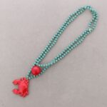collar-largo-cuentas-cristales-facetados-colgante-cangrejo-metal-agua-marina.jpg